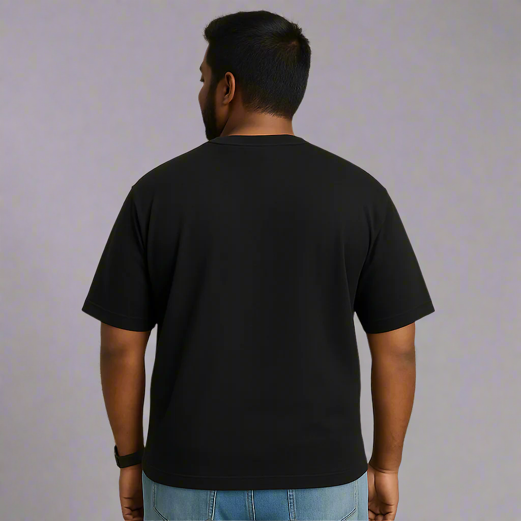 Person wearing a black t-shirt on a beige background